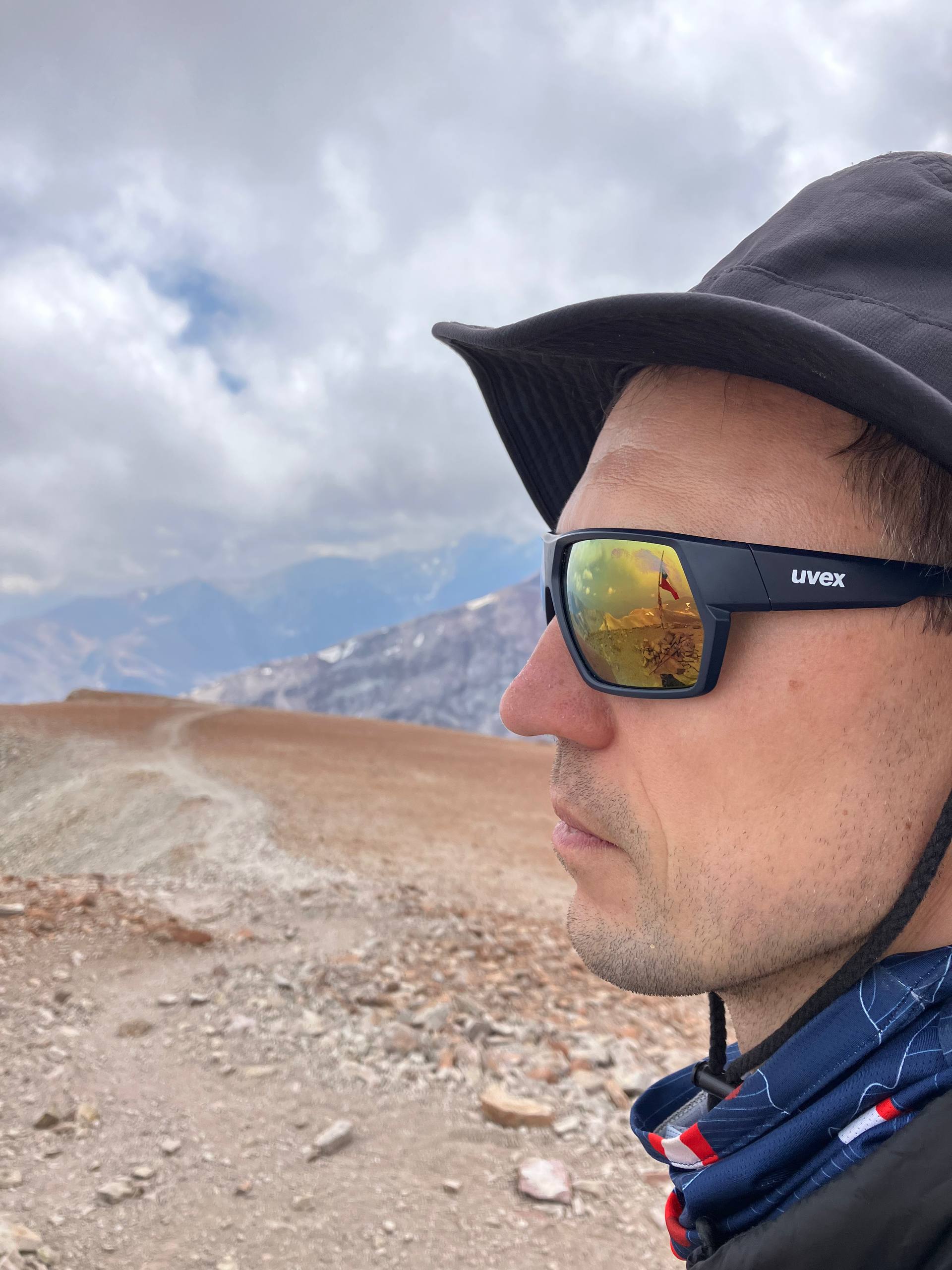 The reflection of the Andes in my father's stylish sunglasses.